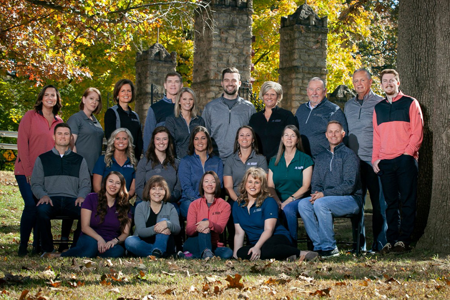 About Our Agency - Casual Group Portrait of the Capstone Insurers Team Outdoors